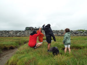 Children waving at a passing steam loco